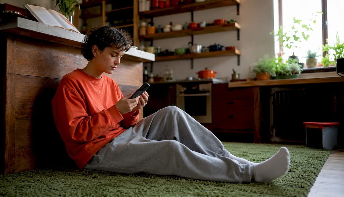 Person using dry herb vaporizer indoors