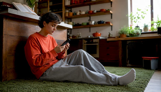 Person using dry herb vaporizer indoors