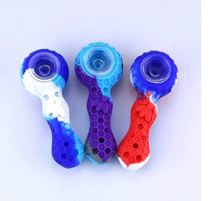 Silicone cannabis pipe with textured grip designed to help users with reduced hand dexterity hold the pipe securely.